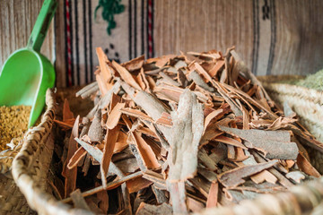 Fototapeta na wymiar Dried skin of the tree found in Morocco spice market. Local gem. Good idea for a souvenir, to bring up the sweet and fragrant memories of the country.
