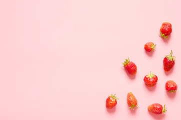 Strawberry on pink background. Flat lay, top view. Copy space.- Image