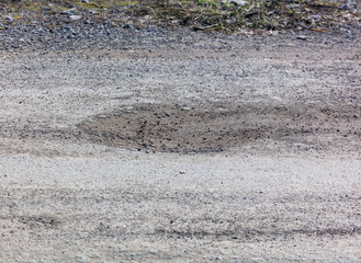 Corroded asphalt on the road