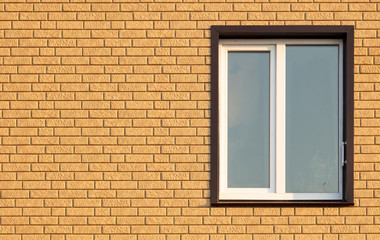 Obraz na płótnie Canvas A window in a house with brick walls