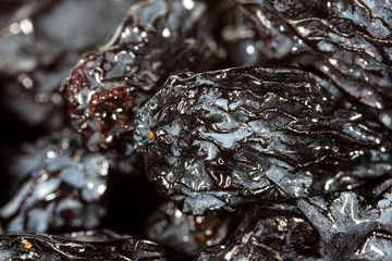 Black dry raisins as background