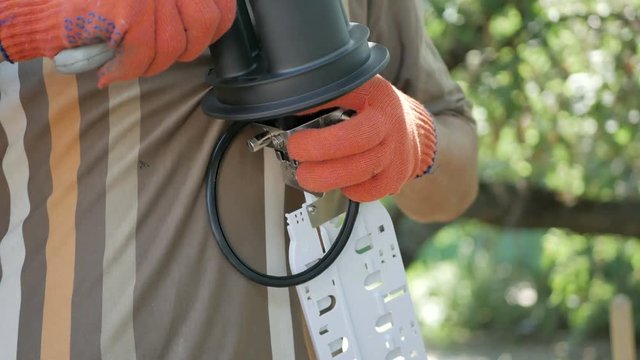 Technicians are installing optic fiber with cable ties.