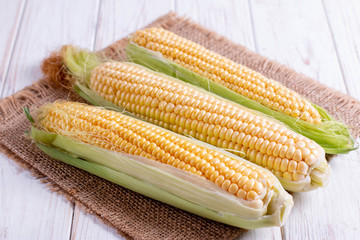 Sweet corn on a white wooden table