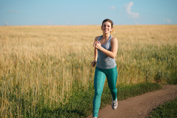 Sport, fitness, health care, cardio training. Active woman with athletic body running in the...