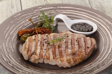 Grilled pork steak with pepper sauce