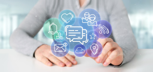 Businessman holding a cloud of social media network icon