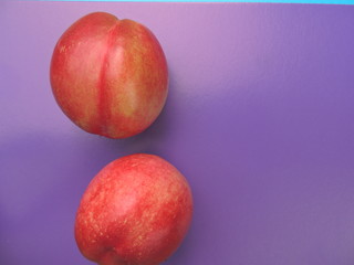sweet and juicy nectarine on blue background.