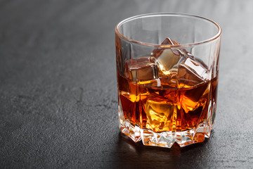 Glass of scotch whiskey and ice.