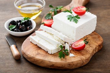Sliced Feta cheese with herbs and olive oil.