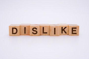 Dislike Word Written In Wooden Cube With White Background Concept