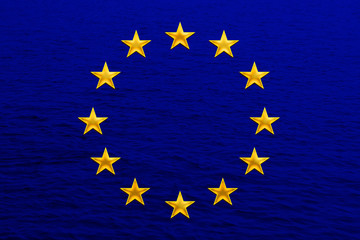 European Union flag, symbol of united Europe on soft silk with soft folds, close-up