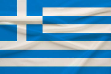 National flag of the country Greece on delicate silk with wind folds, travel concept, immigration, politics, copy space, close-up