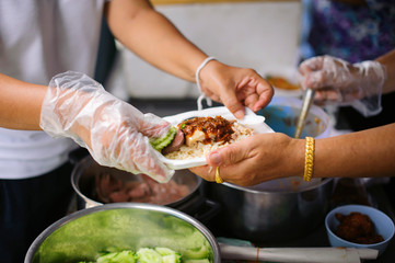 Help serving free food to the poor Needy : concept  Hunger
