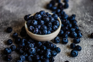 Organic blueberries on stone background