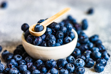 Organic blueberries on stone background