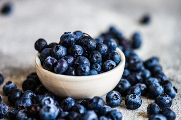 Organic blueberries on stone background