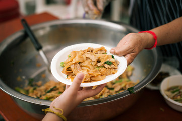 Help serving free food to the poor Needy : concept  Hunger