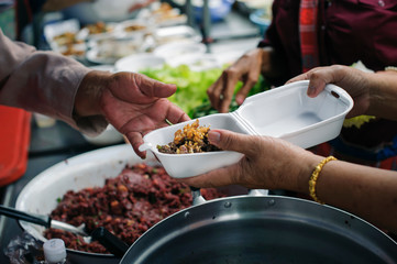 Help serving free food to the poor Needy : concept Sharing Food With Homeless