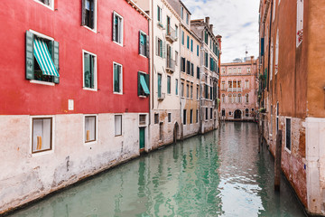 Fototapeta na wymiar Old and colorful houses of venice - venice canal, Italy