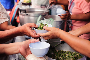 concept Tackling Hunger and Food : Donate food to the poor and the poor who suffer from starvation