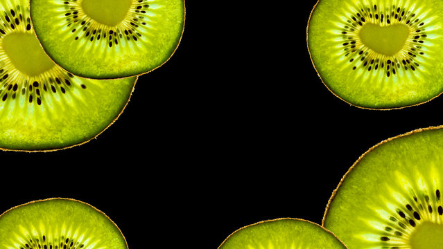 Copy space with isolated kiwi fruit with a heart-shaped core on black background
