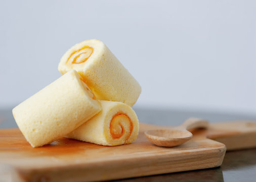 Yamroll cake on wood tray