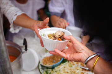 Volunteers Share Food to the Poor to Relieve Hunger : Beggar begs food from donors