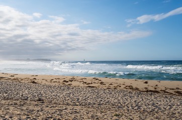 Waves on a sand beach shore.