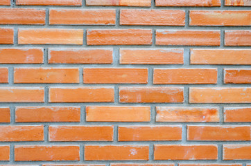 Old red brick wall with blurred pattern background