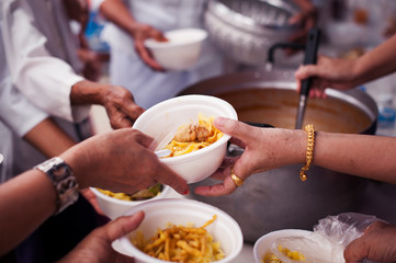 concepts of poverty in Asian society : Volunteers Share Food to the Poor to Relieve Hunger