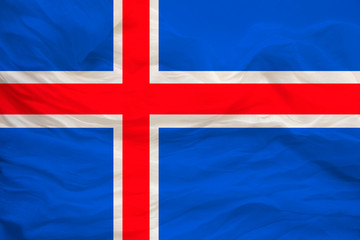 Fototapeta premium national flag of the country iceland on delicate silk with creases from the wind, concept of travel, immigration, politics, copy space, close-up