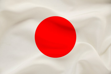 national flag of the country japan on gentle silk with wind folds, travel concept, immigration, politics, copy space, close-up