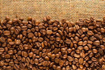 Coffee Beans on Coarse Burlap. A variety of coffee. Texture, background.