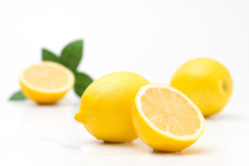 Naklejka na ściany i meble Juicy lemons on a completely white background. Fruits and vitamins.
