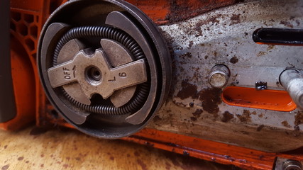 Chainsaw machine parts that are being serviced.