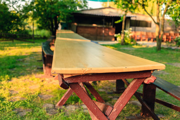 Dinner table in the garden of the camp. Outdoor table for children.