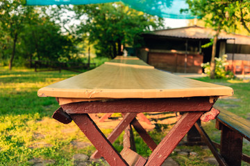 Naklejka premium Dinner table for children in the garden of the camp.