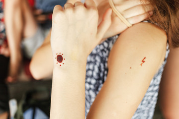 Henna tattoos. Small henna tattoos on the hand of a girl.