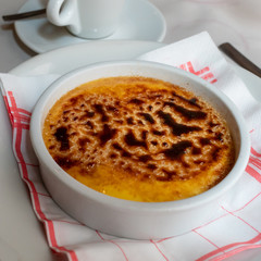 Creme brulee - traditional French vanilla cream dessert with caramelised sugar making on top.