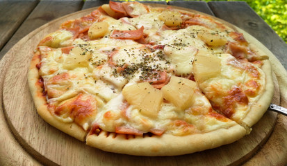 Hot homemade pizza ready to eat on table