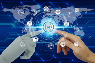 Robot and human hand touching virtual screen Artificial Intelligence technology icon over the Network connection, Artificial Intelligence Technology Concept.
