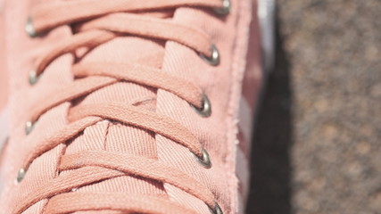 Youth sneakers made of canvas multi-colored fabric.