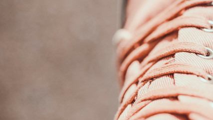 Youth sneakers made of canvas multi-colored fabric.