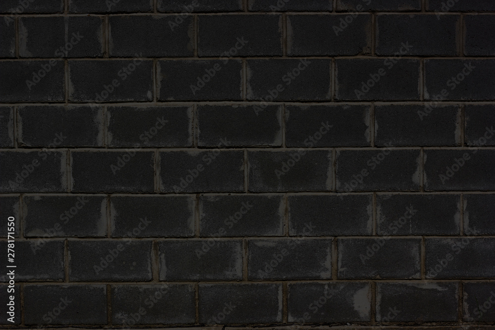 Wall mural texture of black brick wall background. retro abstract closeup of grunge texture dark gray brick wal