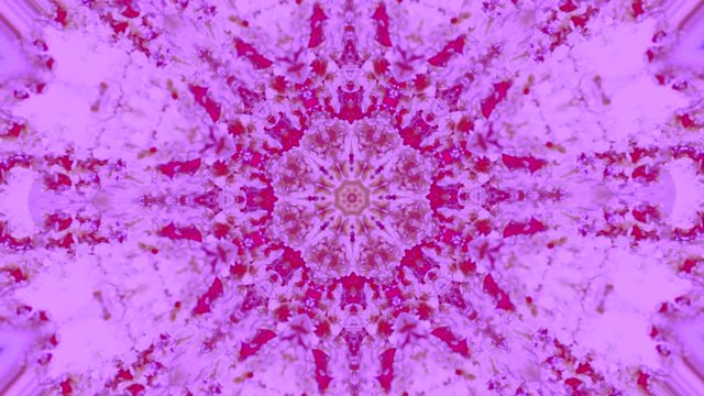 video de mandala con patron de repeticion de varios movimientos cambiantes en colores purpura y rosa 