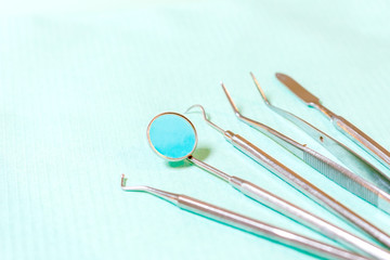 Dentist tools - probe, mirror, tweezers and drill