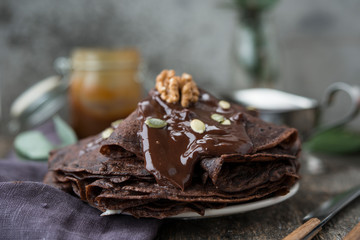 Chocolate pancakes for Breakfast with hot chocolate.Selective focus.