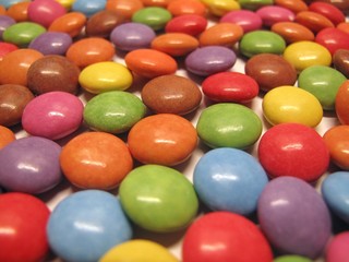 Colourful colorful candies sweets chocolates buttons Smarties Skittles M&M’s