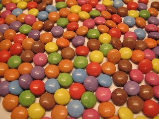Colourful colorful candies sweets chocolates buttons Smarties Skittles M&M’s