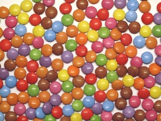Obraz premium Colourful colorful candies sweets chocolates buttons Smarties Skittles M&M’s